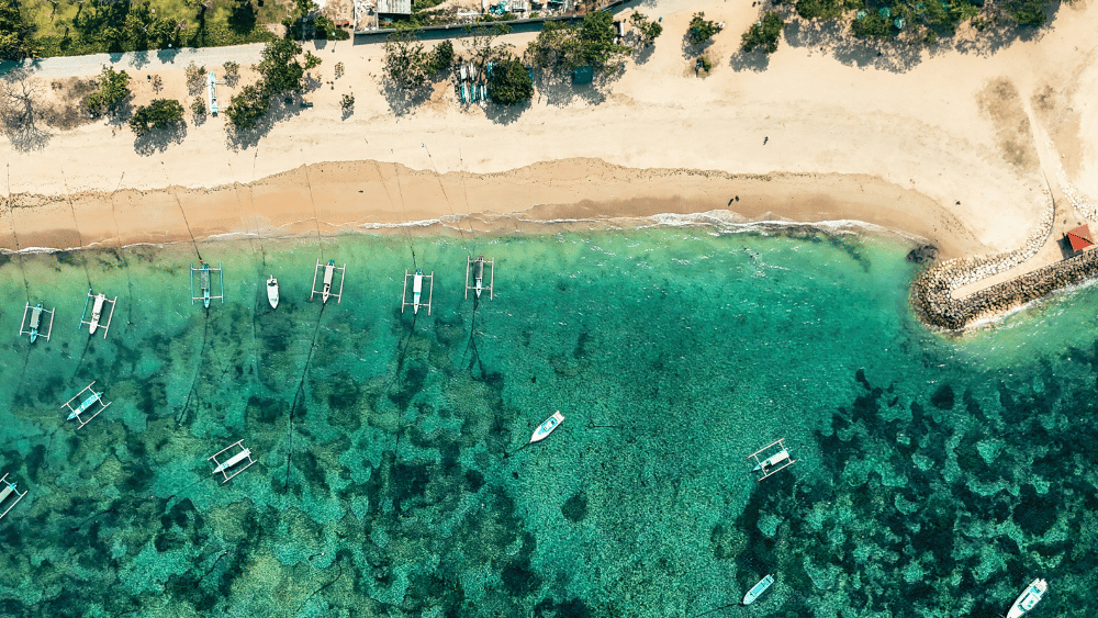 Drone view of Sanur Beach, Bali – coastline near Sanur yoga retreat