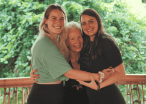 Bali YTT preparation – smiling yoga students hugging their teacher at Power of Now Oasis